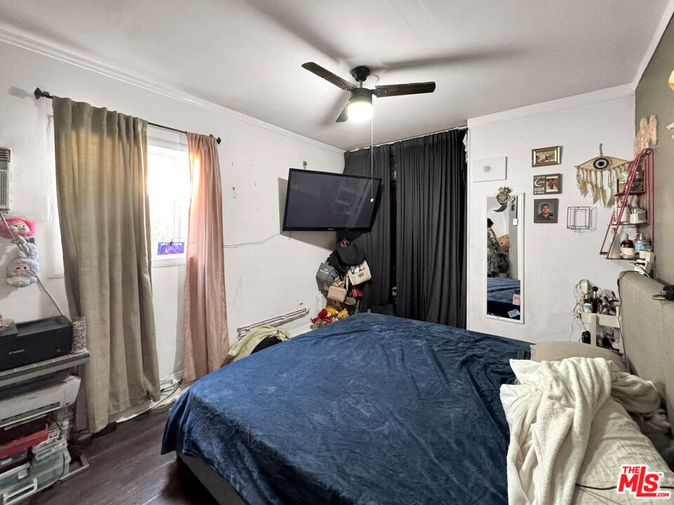 13258 Filmore Street Pacoima, CA 91331 - Photo 12 of 30 a bedroom with bed and a window