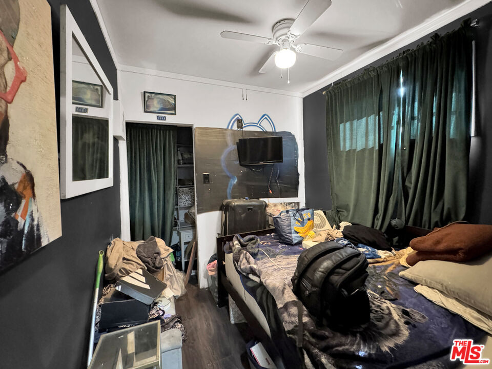 13258 Filmore Street Pacoima, CA 91331 - Photo 14 of 30 a bedroom with furniture and a large window