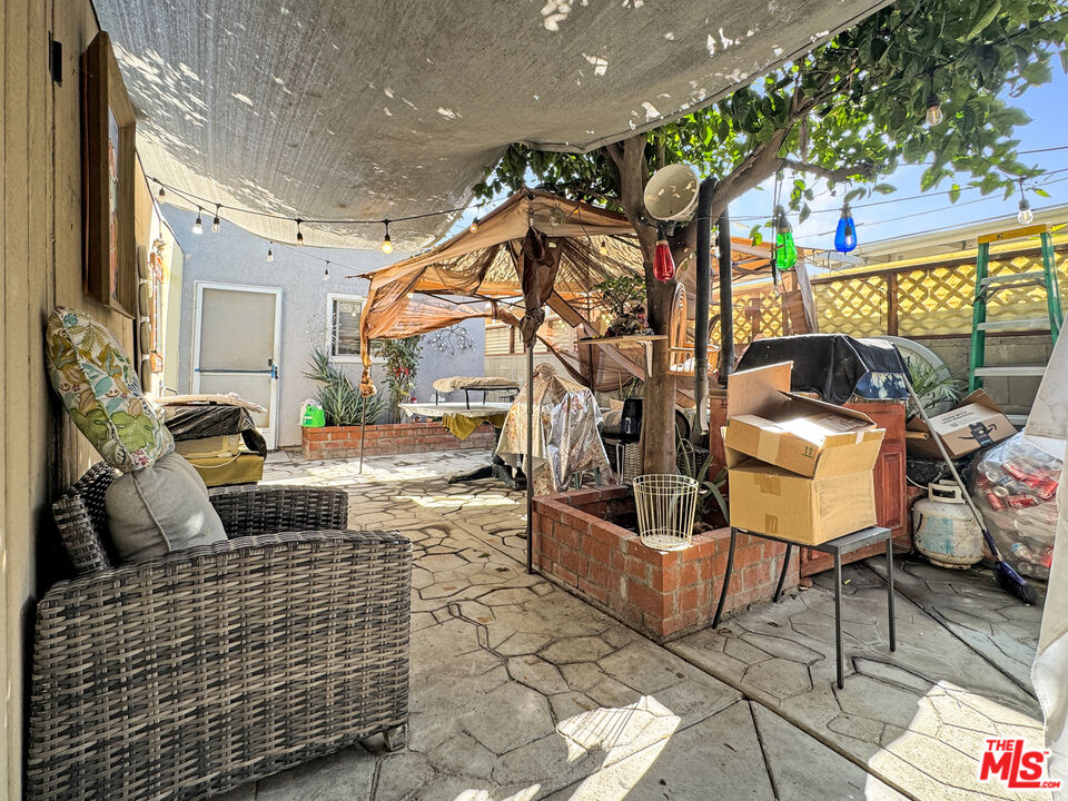 13258 Filmore Street Pacoima, CA 91331 - Photo 16 of 30 a view of a patio with couches and potted plants