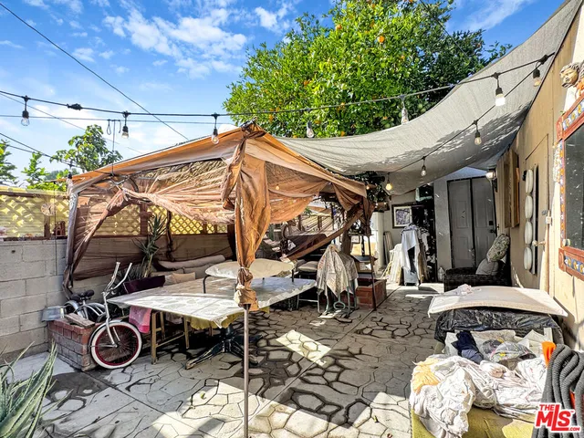 a view of outdoor space with table and chairs