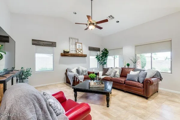 a living room with furniture and a large window