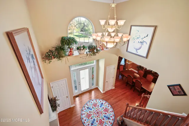 a kitchen with a stove a sink a dining table and chairs