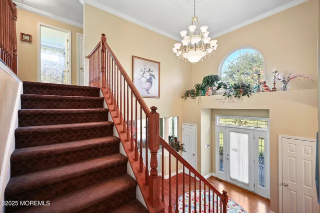 a kitchen with stainless steel appliances granite countertop a stove a sink dishwasher and a wooden cabinets