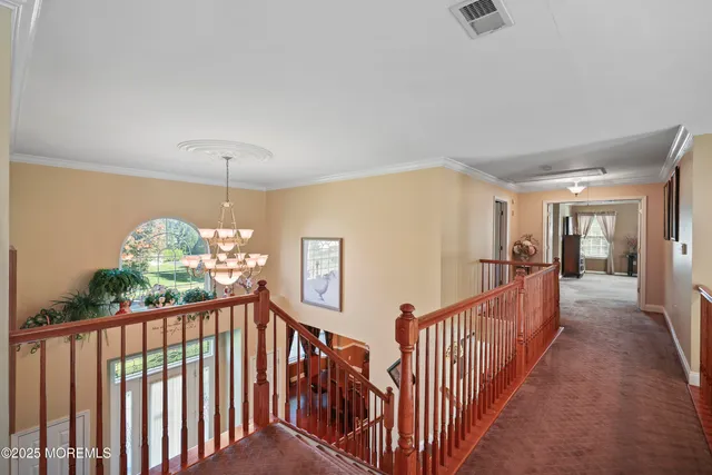 a kitchen with a table chairs sink and cabinets