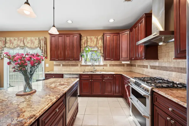 a very nice looking dining room with a large window