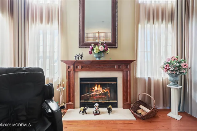 a bedroom with furniture and large windows