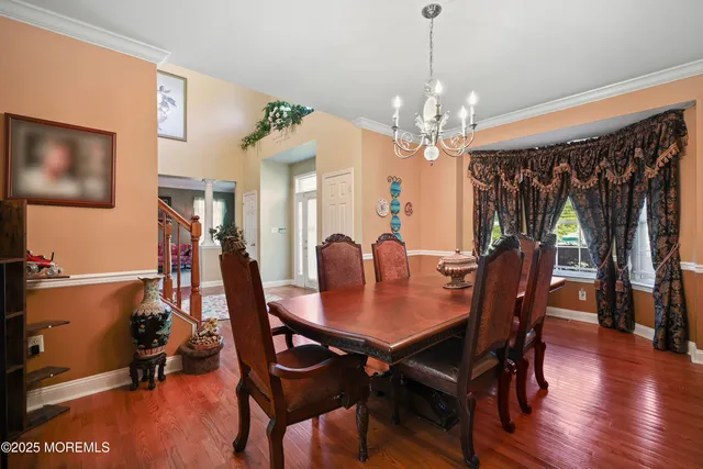 a bedroom with a bed closet and mirror
