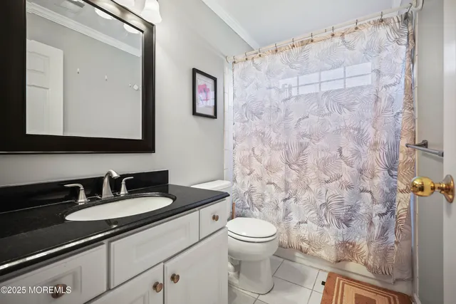 a front view of a house with a yard and fountain