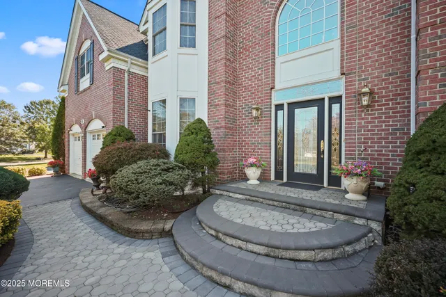 a view of a house with potted plants