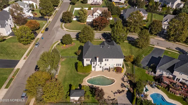 an aerial view of a house with outdoor space