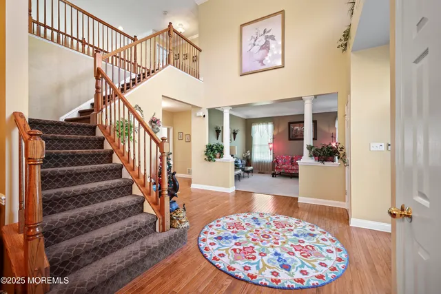 a view of a hallway with paintings on the wall