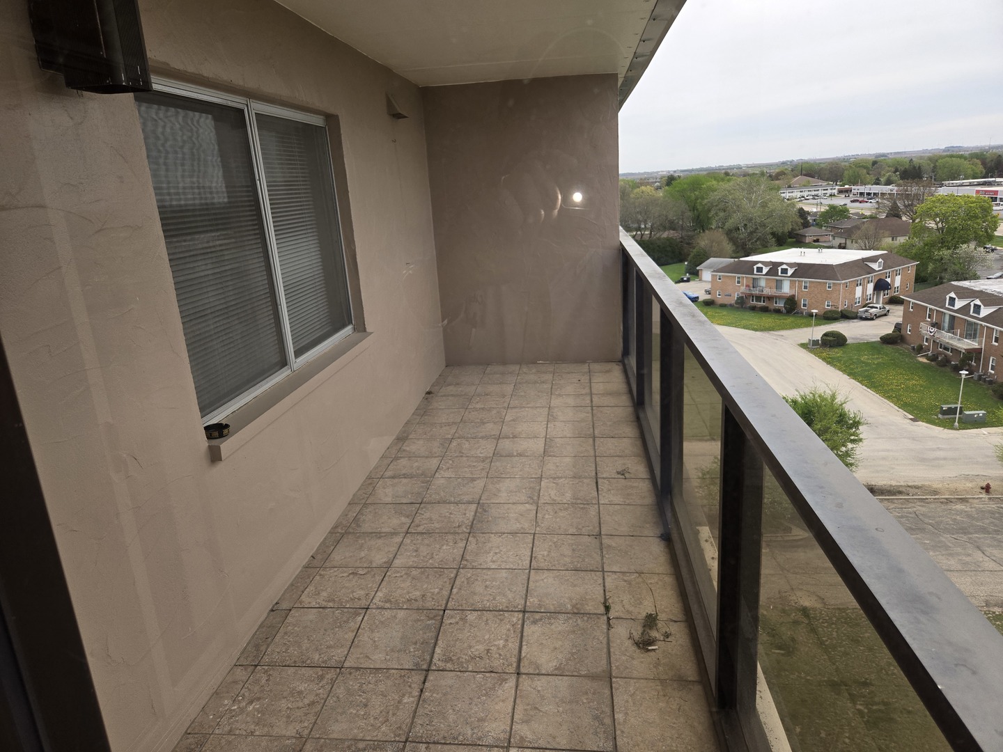 1133 North 7th Street, Unit 802 Rochelle, IL 61068 - Photo 12 of 12 a balcony with view of car parked