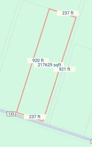 a view of a hall with an empty space and a window