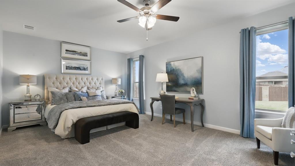 9708 Austin Holw Road Fort Worth, TX 76036 - Photo 15 of 35 a bedroom with a bed and a chandelier