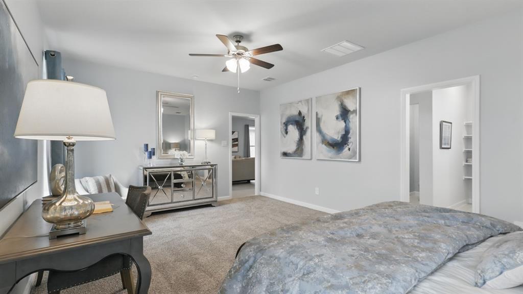 9708 Austin Holw Road Fort Worth, TX 76036 - Photo 17 of 35 a bedroom with furniture and a chandelier