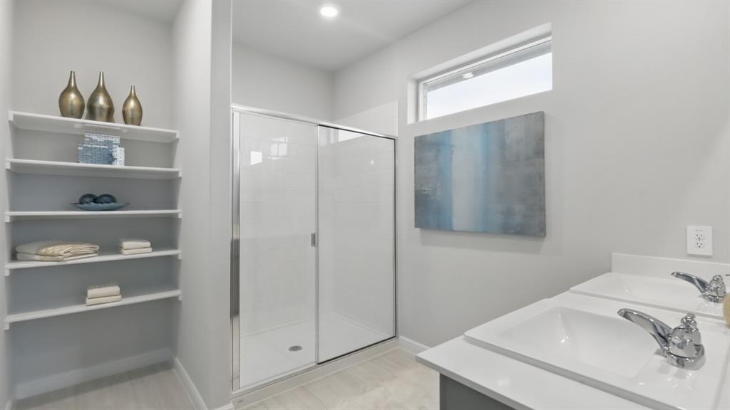 9708 Austin Holw Road Fort Worth, TX 76036 - Photo 19 of 35 a bathroom with a sink and a mirror