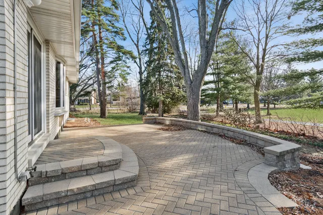 a view of a table and chairs in the yard