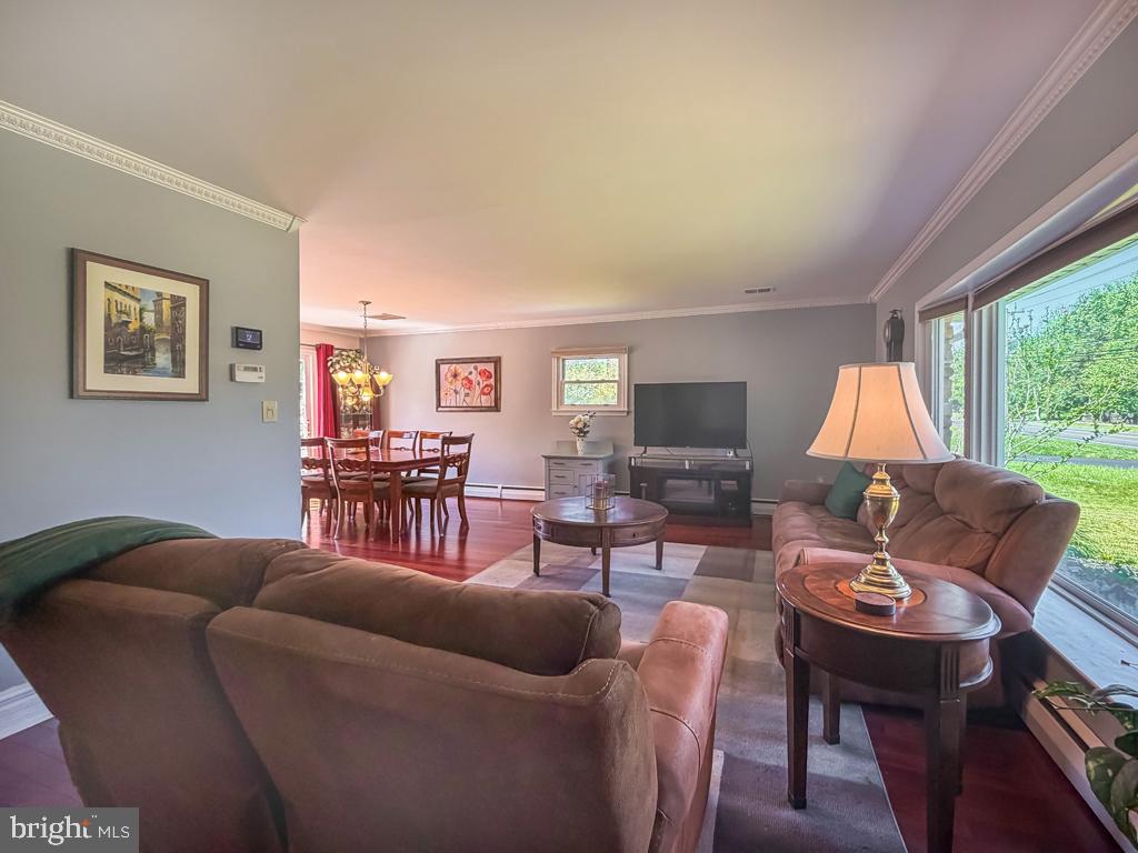 925 Big Oak Road Yardley, PA 19067 - Photo 9 of 51 a living room with furniture a flat screen tv and a large window