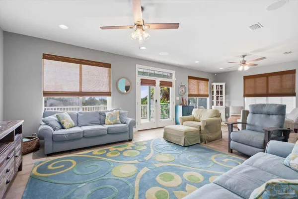a living room with furniture and a large window