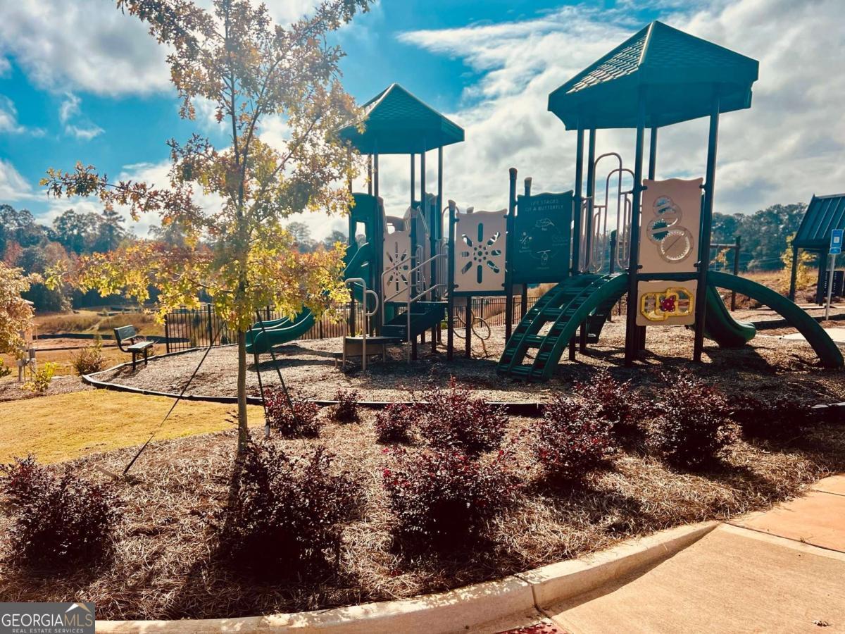 350 Jarrette Street, Unit 54 Fairburn, GA 30213 - Photo 6 of 11 a view of a park with iron fence
