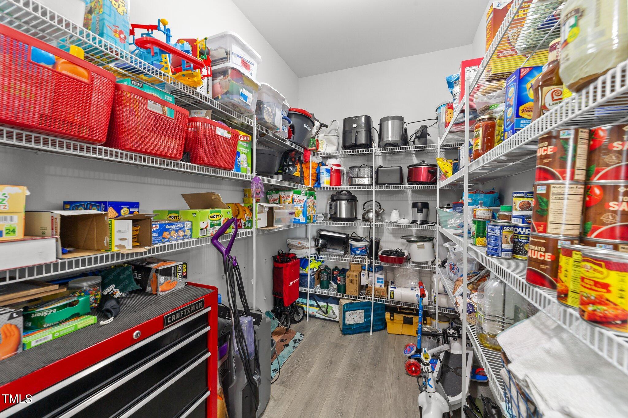 166 Yellow Jacket Ridge Clayton, NC 27520 - Photo 16 of 39 a utility room with lots of clutter and bicycles