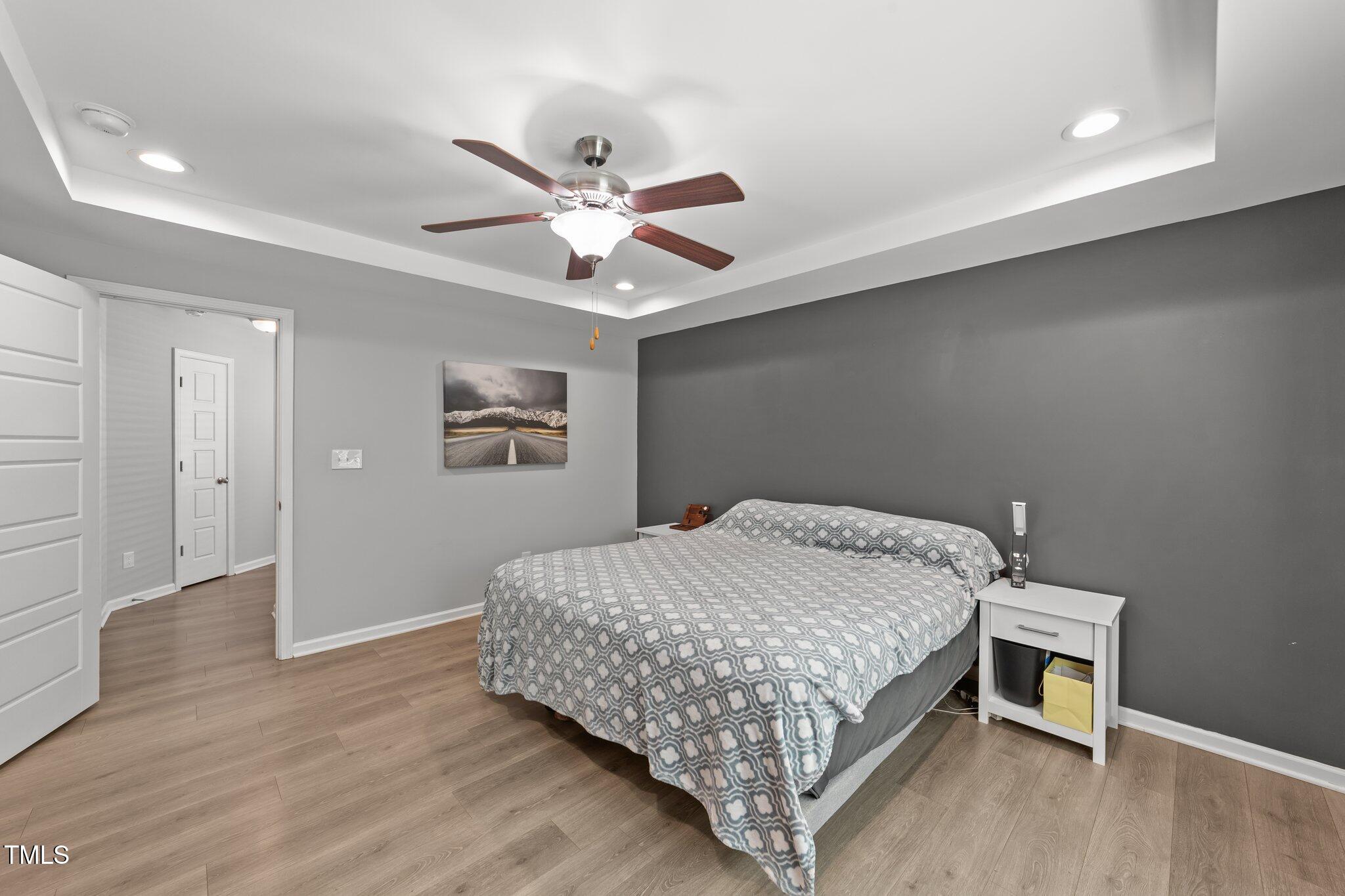 166 Yellow Jacket Ridge Clayton, NC 27520 - Photo 20 of 39 a bedroom with a bed and a window