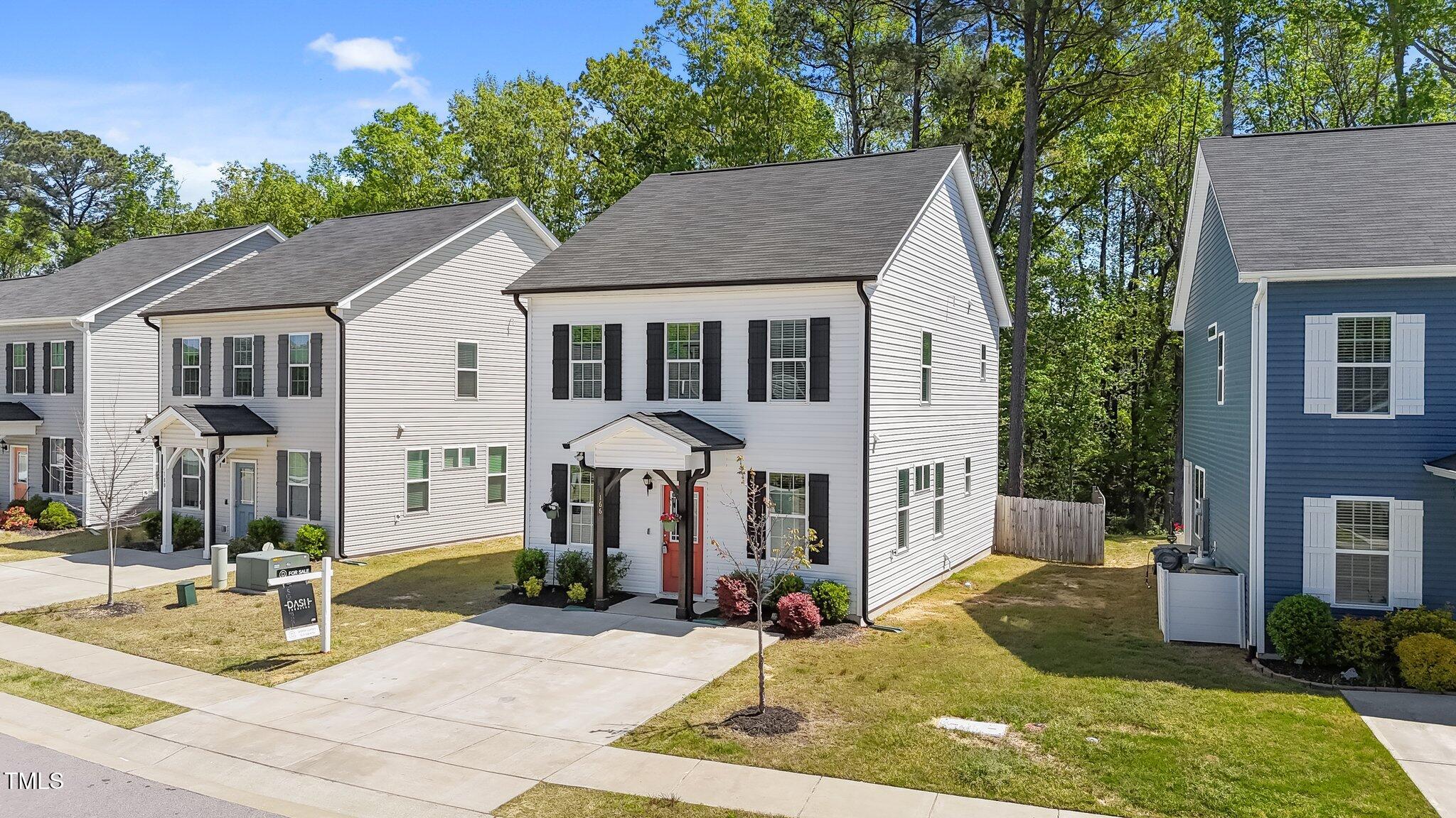 166 Yellow Jacket Ridge Clayton, NC 27520 - Photo 2 of 39 a front view of a house with garden