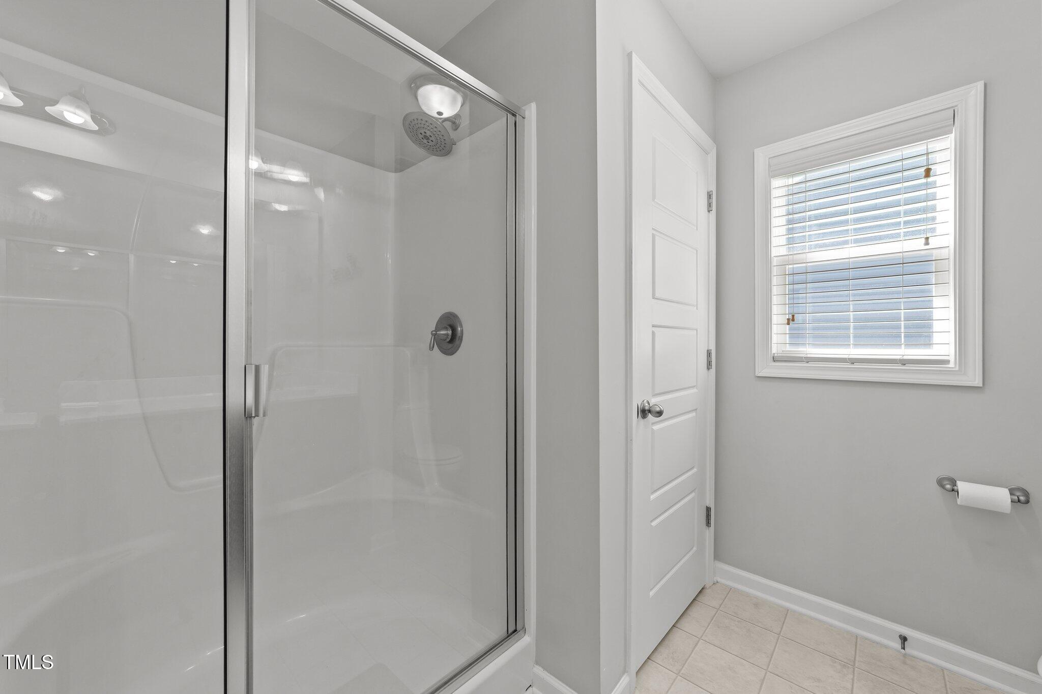 166 Yellow Jacket Ridge Clayton, NC 27520 - Photo 22 of 39 a bathroom with a shower and a sink