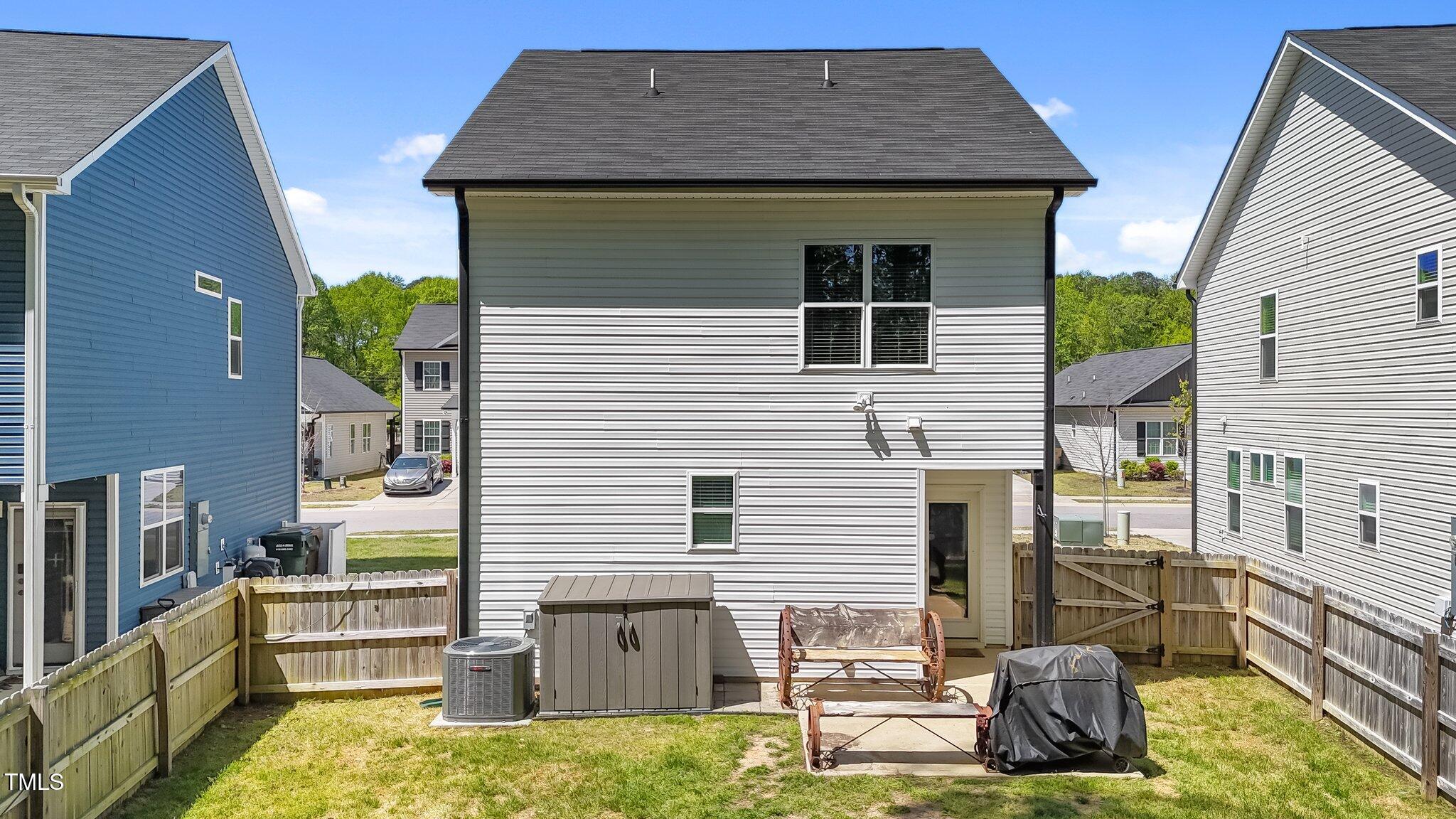 166 Yellow Jacket Ridge Clayton, NC 27520 - Photo 28 of 39 a front view of a house with a yard