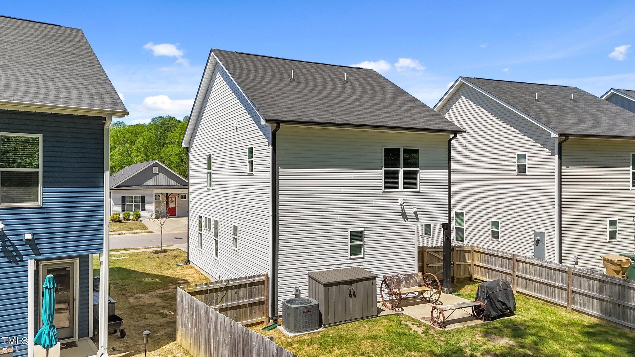 166 Yellow Jacket Ridge Clayton, NC 27520 - Photo 29 of 39 a view of house with backyard and sitting area