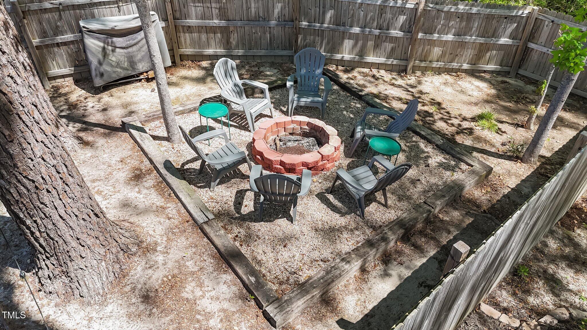 166 Yellow Jacket Ridge Clayton, NC 27520 - Photo 33 of 39 a view of a chairs and table in wooden roof