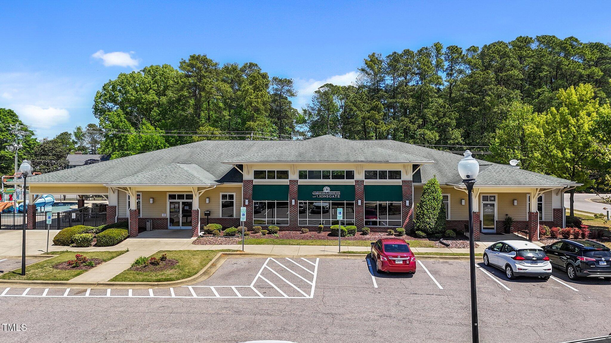 166 Yellow Jacket Ridge Clayton, NC 27520 - Photo 35 of 39 a view of patio with table and chairs under an umbrella
