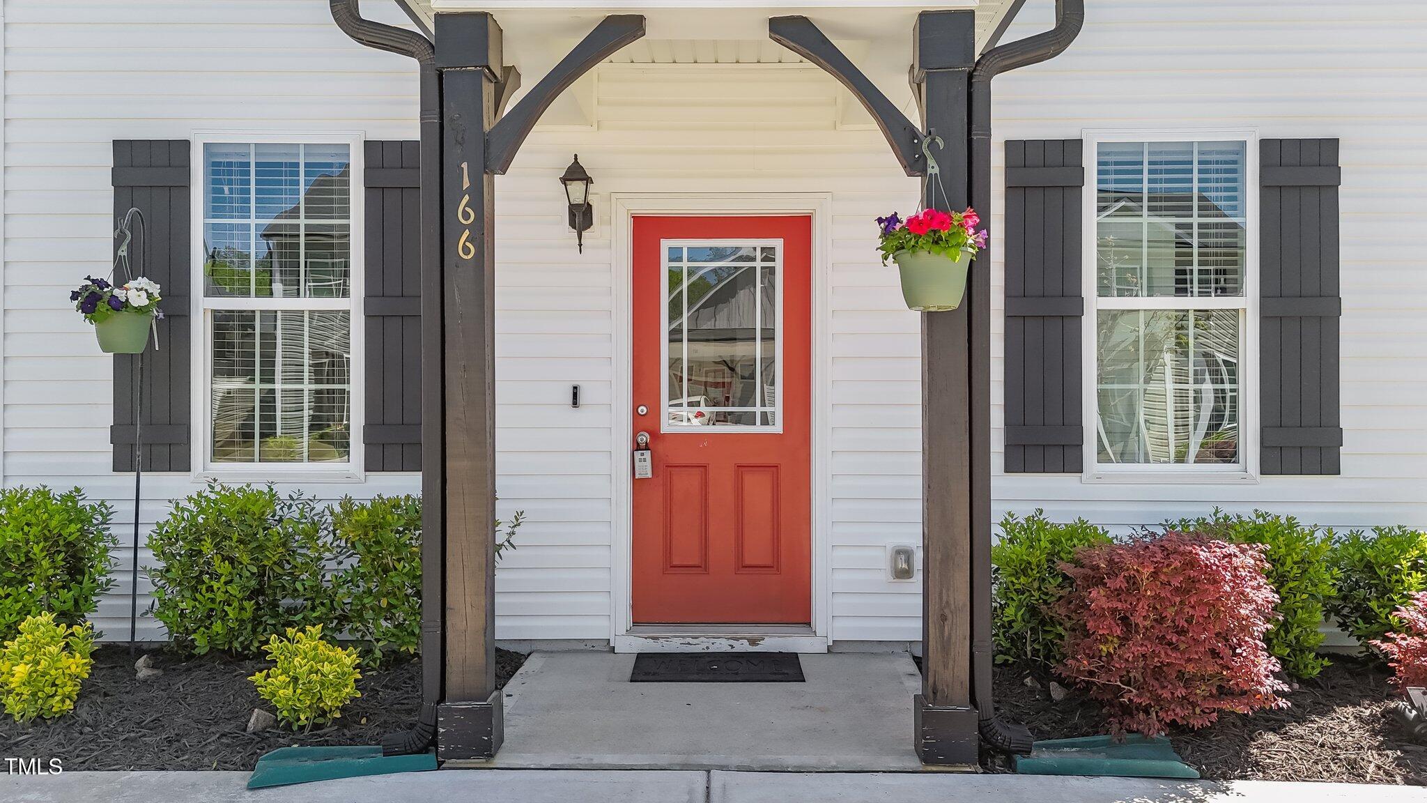 166 Yellow Jacket Ridge Clayton, NC 27520 - Photo 4 of 39 a front view of a house with a porch