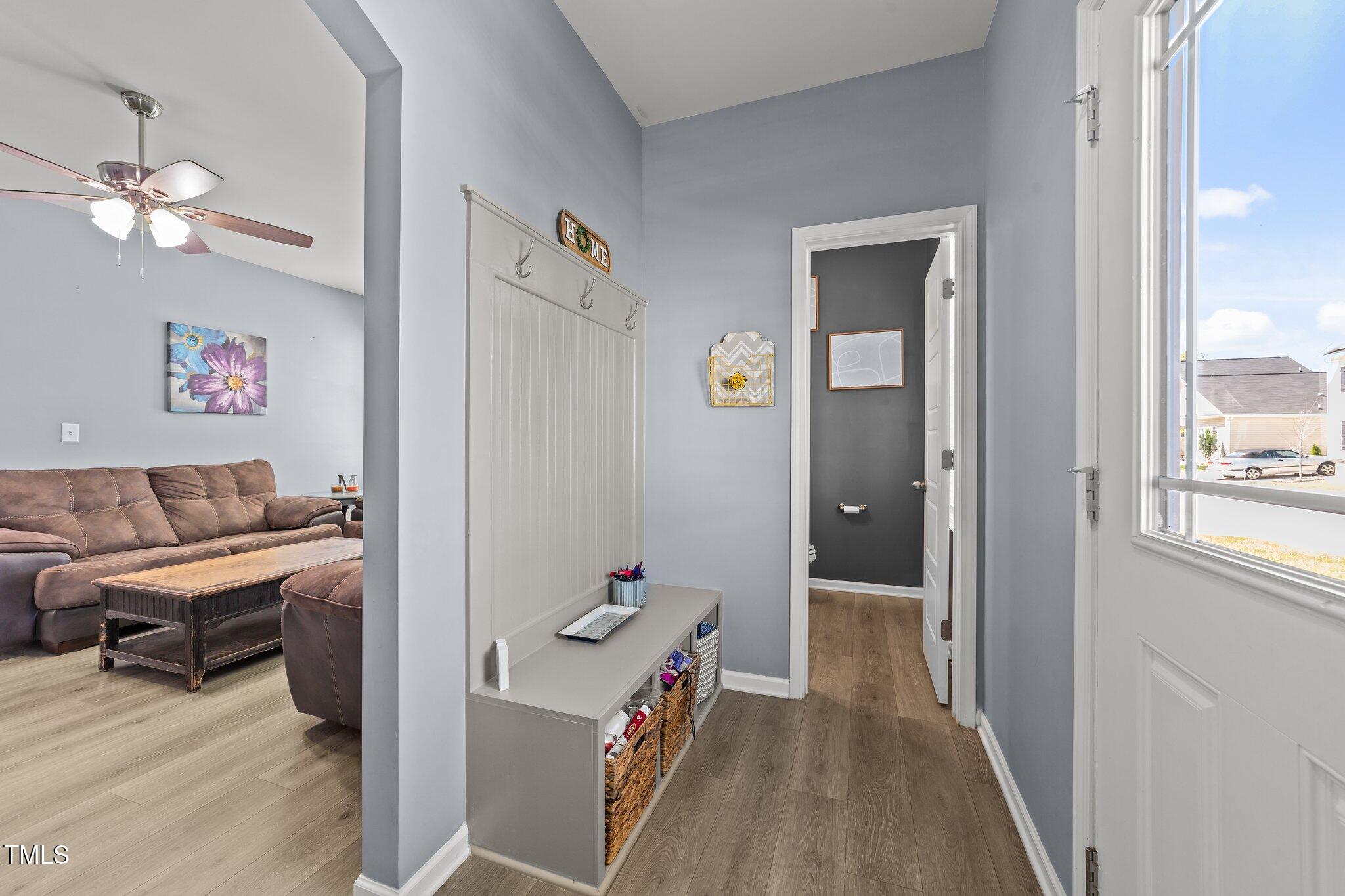 166 Yellow Jacket Ridge Clayton, NC 27520 - Photo 5 of 39 a area with chandelier fan and a bathroom