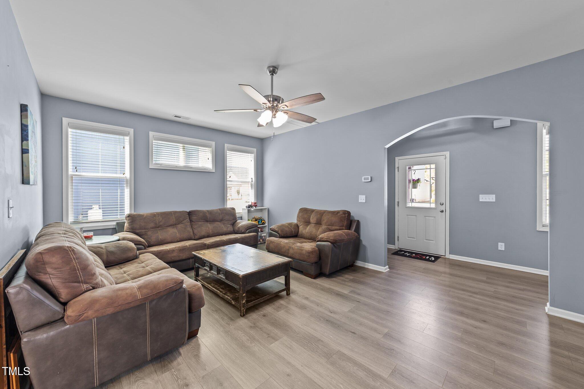 166 Yellow Jacket Ridge Clayton, NC 27520 - Photo 7 of 39 a living room with couches and a view of kitchen