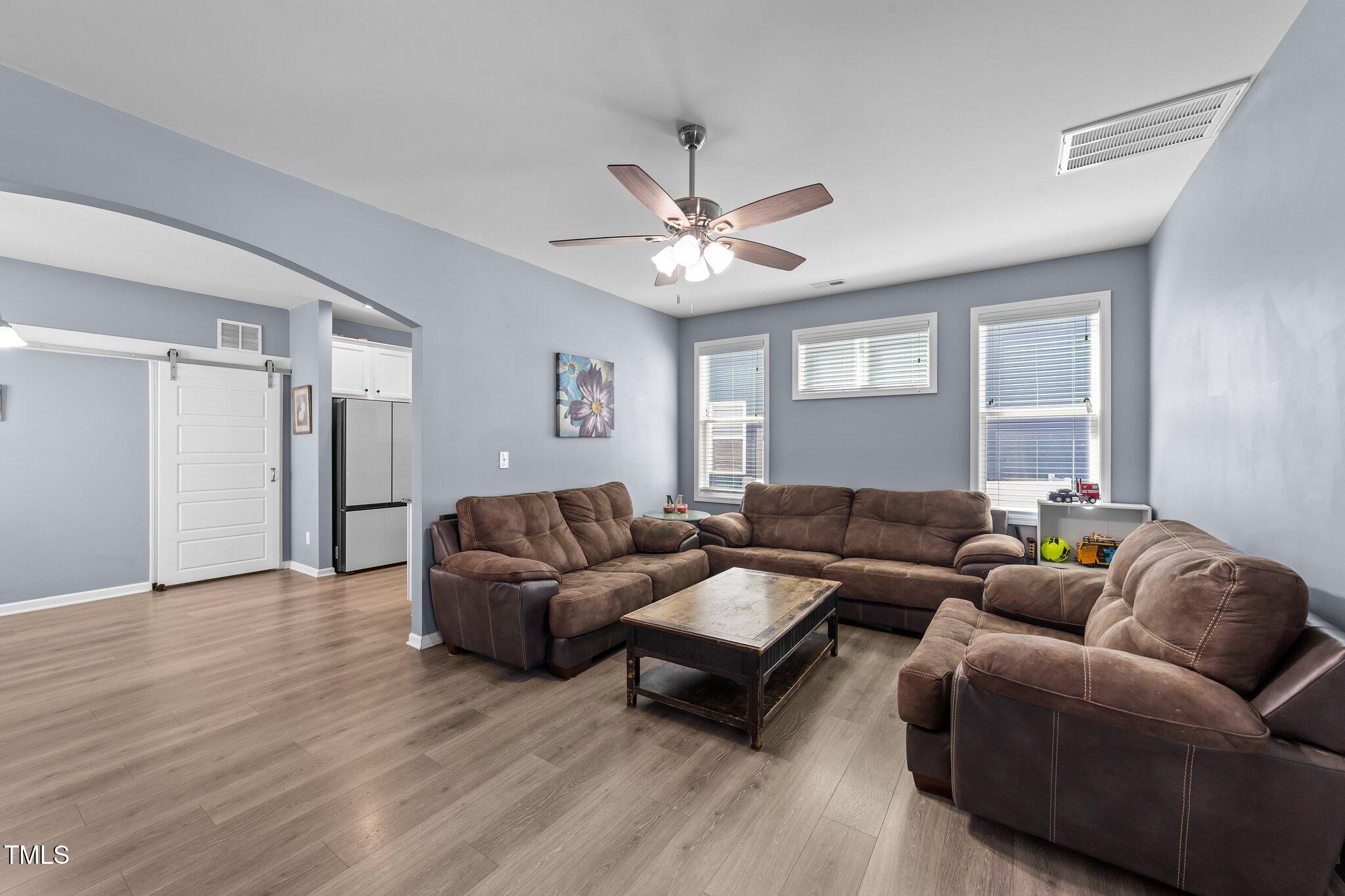 166 Yellow Jacket Ridge Clayton, NC 27520 - Photo 8 of 39 a living room with furniture and a wooden floor