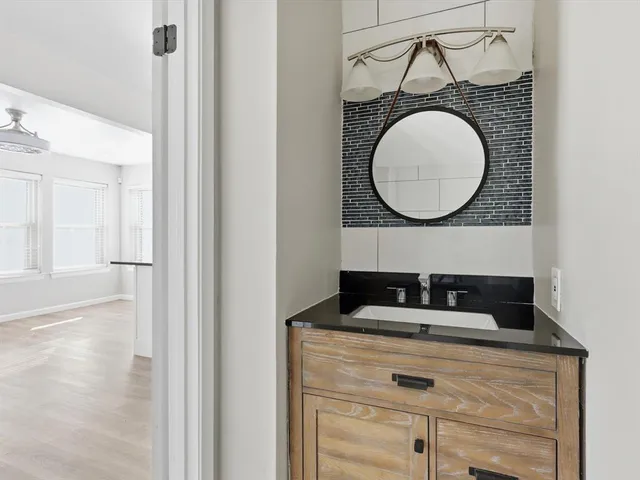 a bathroom with a sink and a mirror