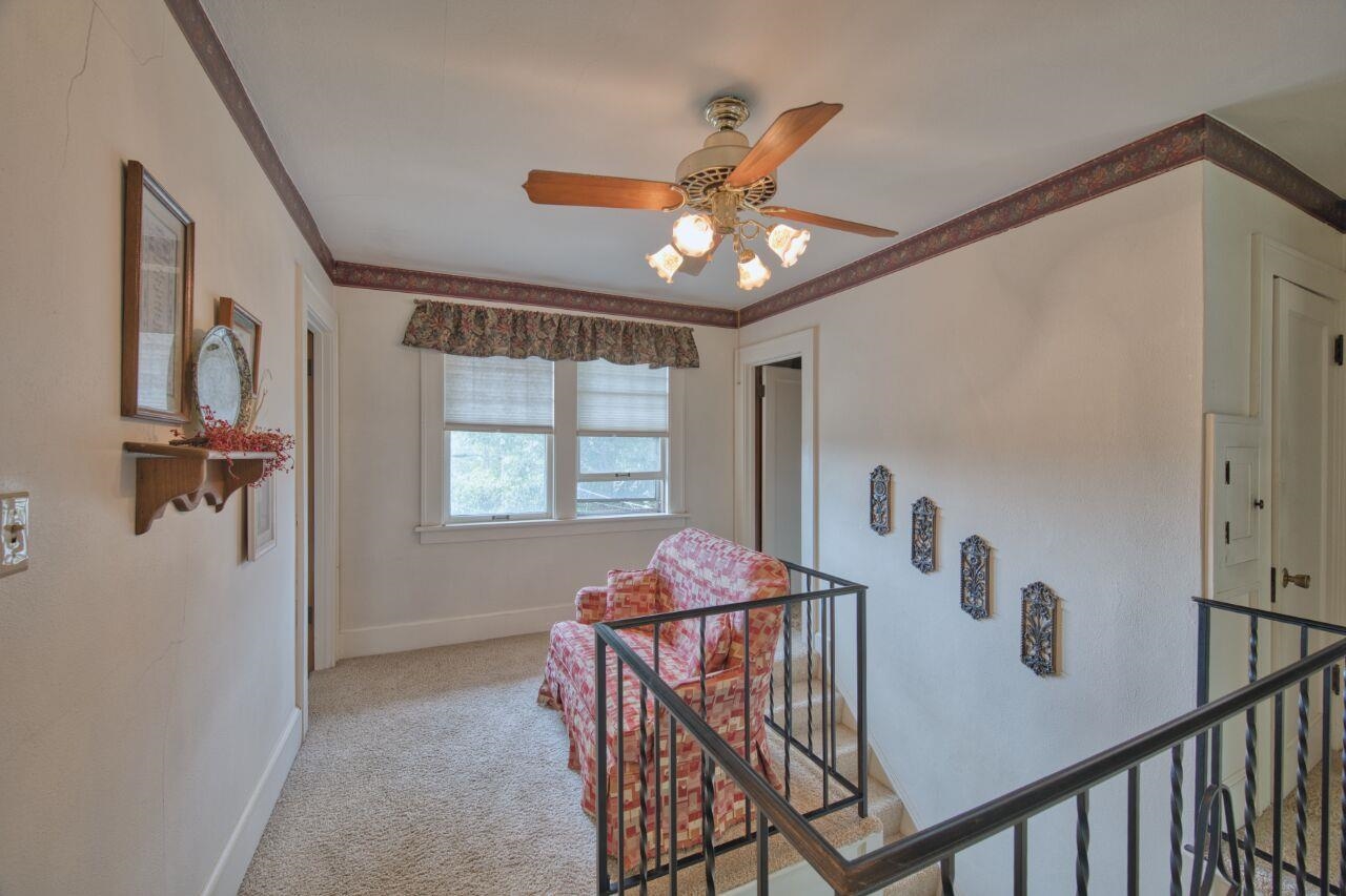 701 Grant Avenue Eveleth, MN 55734 - Photo 20 of 50 Corridor with carpet flooring, an upstairs landing, and crown molding