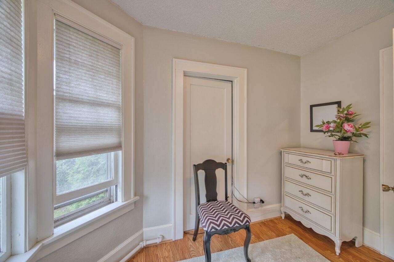 701 Grant Avenue Eveleth, MN 55734 - Photo 25 of 50 Living area featuring light wood-style floors and a textured ceiling