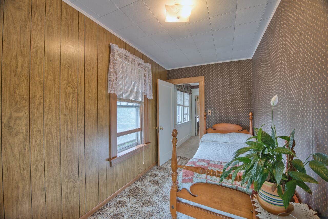 701 Grant Avenue Eveleth, MN 55734 - Photo 29 of 50 Bedroom with carpet floors and crown molding