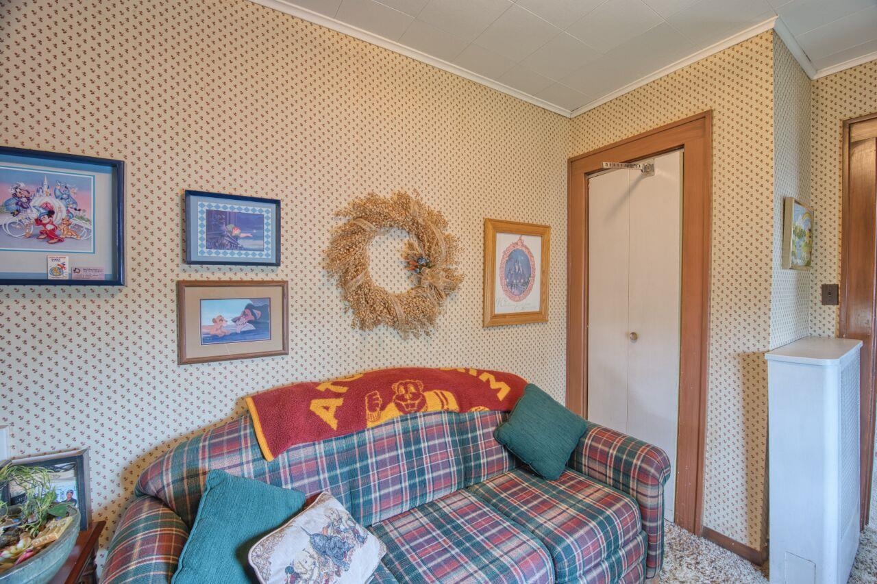 701 Grant Avenue Eveleth, MN 55734 - Photo 32 of 50 Bedroom with ornamental molding, a closet, and wallpapered walls