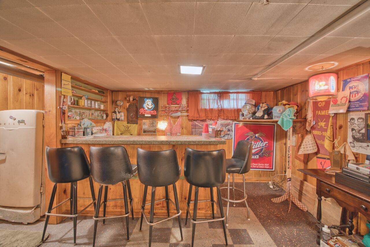 701 Grant Avenue Eveleth, MN 55734 - Photo 34 of 50 Indoor dry bar featuring wooden walls