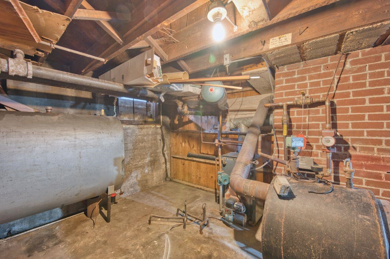 701 Grant Avenue Eveleth, MN 55734 - Photo 39 of 50 Unfinished basement featuring heating fuel and a heating unit