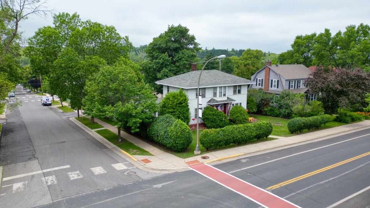 701 Grant Avenue Eveleth, MN 55734 - Photo 45 of 50 View of asphalt road with sidewalks, curbs, and street lights