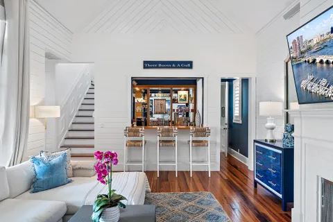 a living room with fireplace furniture and a flat screen tv