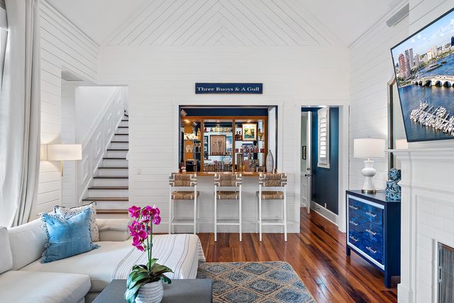 a living room with fireplace furniture and a flat screen tv