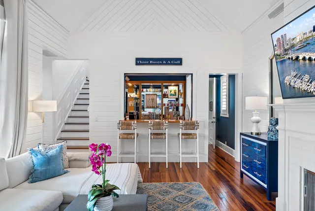 a living room with fireplace furniture and a flat screen tv