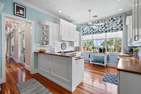 a kitchen with stainless steel appliances granite countertop a stove and cabinets