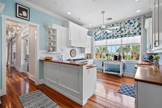 a kitchen with stainless steel appliances granite countertop a stove and cabinets
