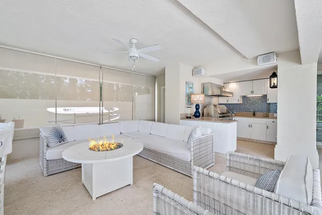 a kitchen with a sink a stove and a window